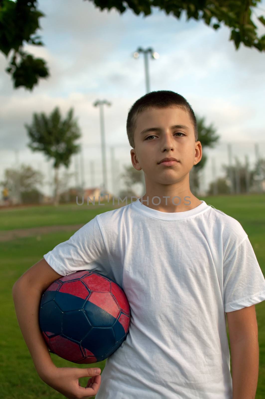 Young  boy with soccer ball .