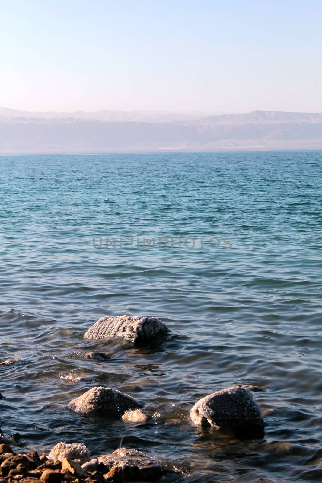 Dead Sea coastline, whit salt crystals and formations in the sand. Jordan