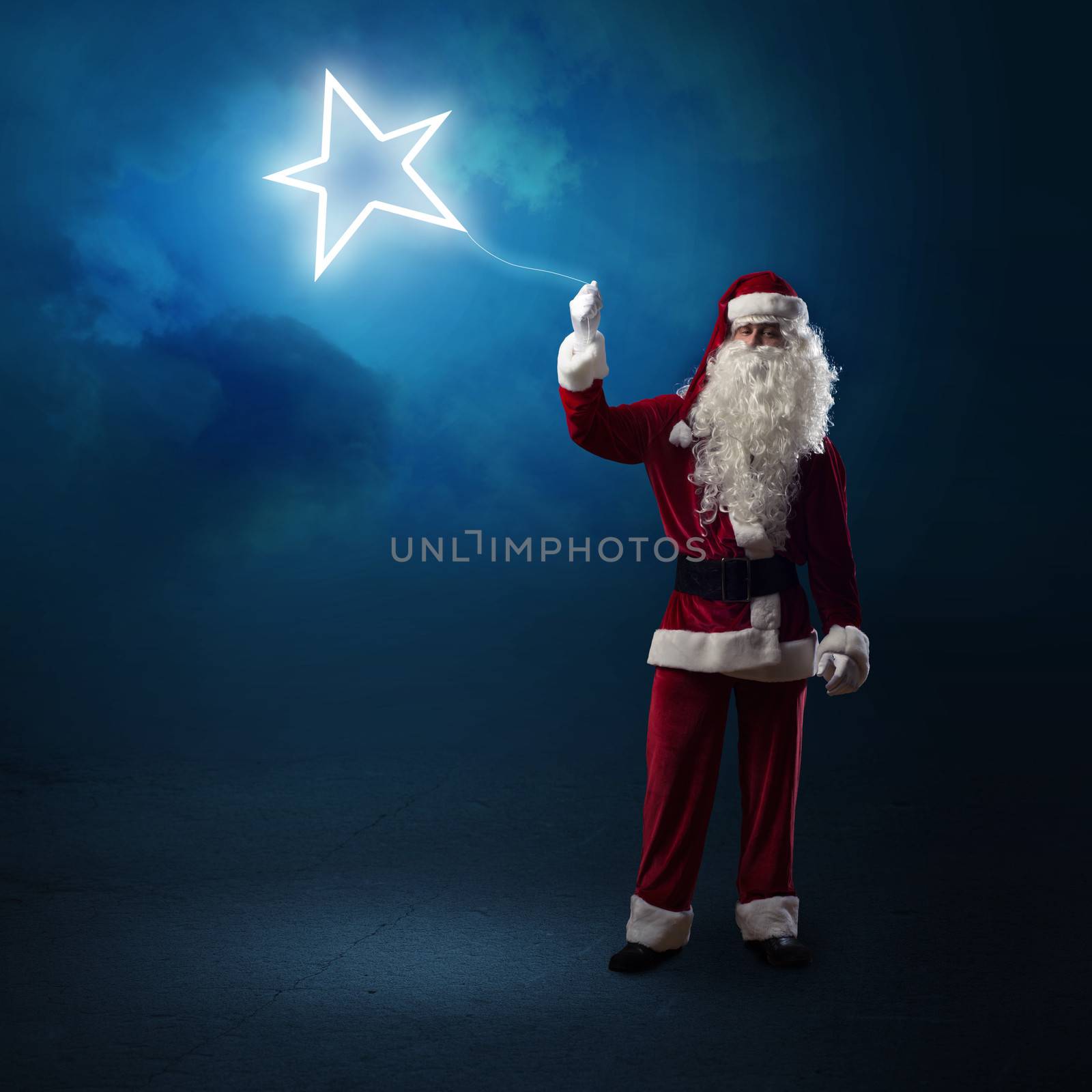 Santa Claus is holding a shining star by adam121