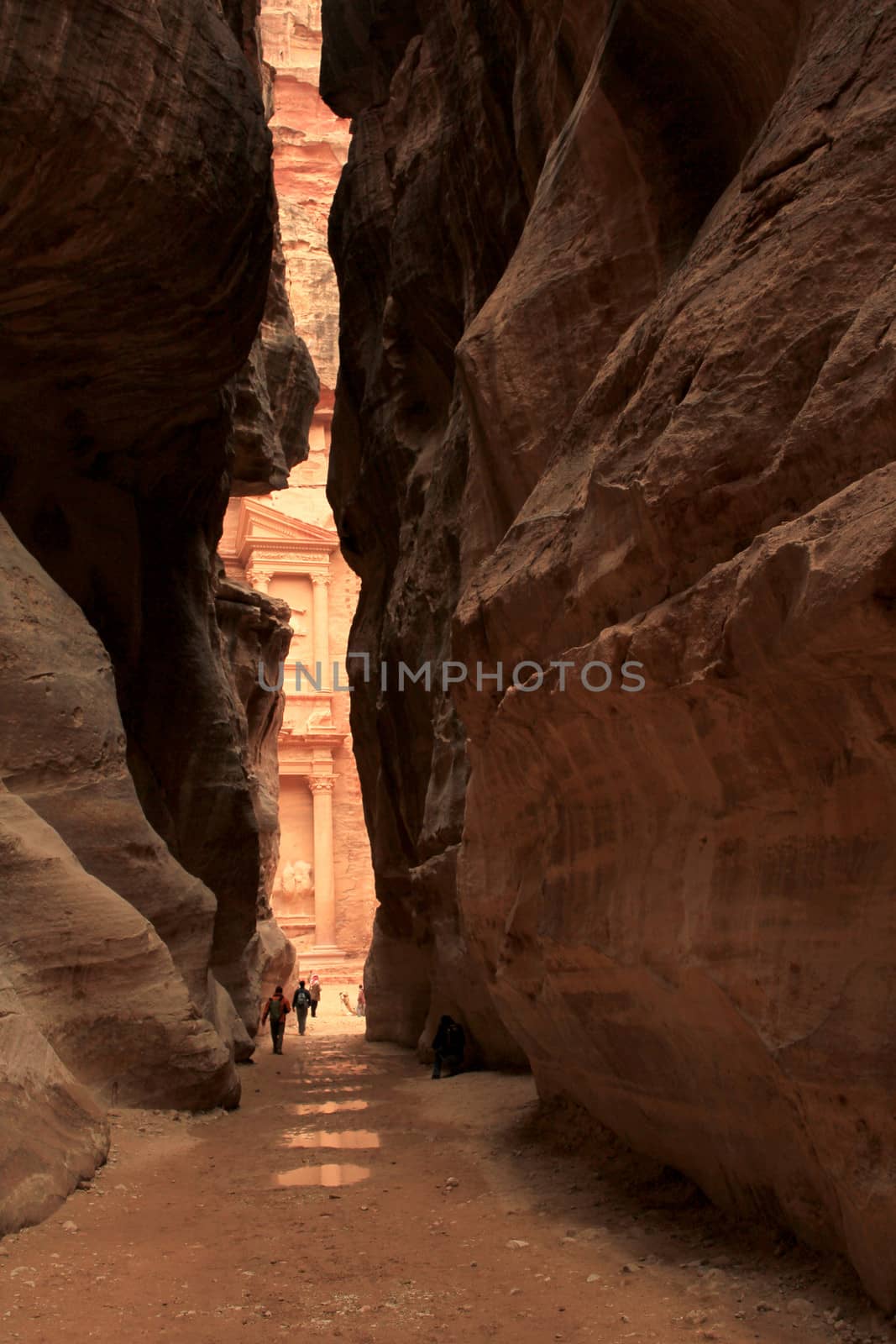 Rosy red walls of the Siq canyon, leading to the Treasury in Petra, Jordan.