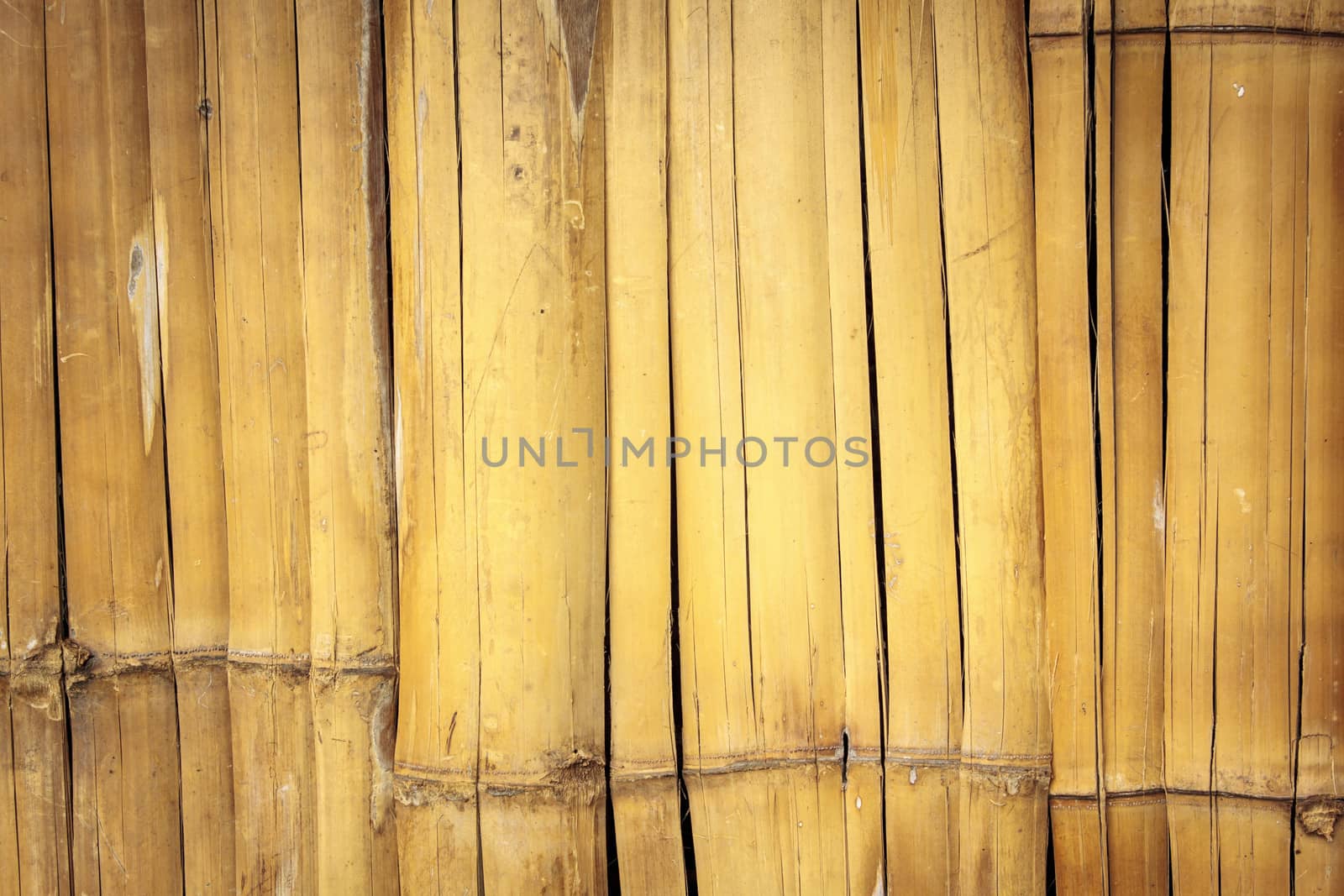Old wall from the tied up wooden planks on background.