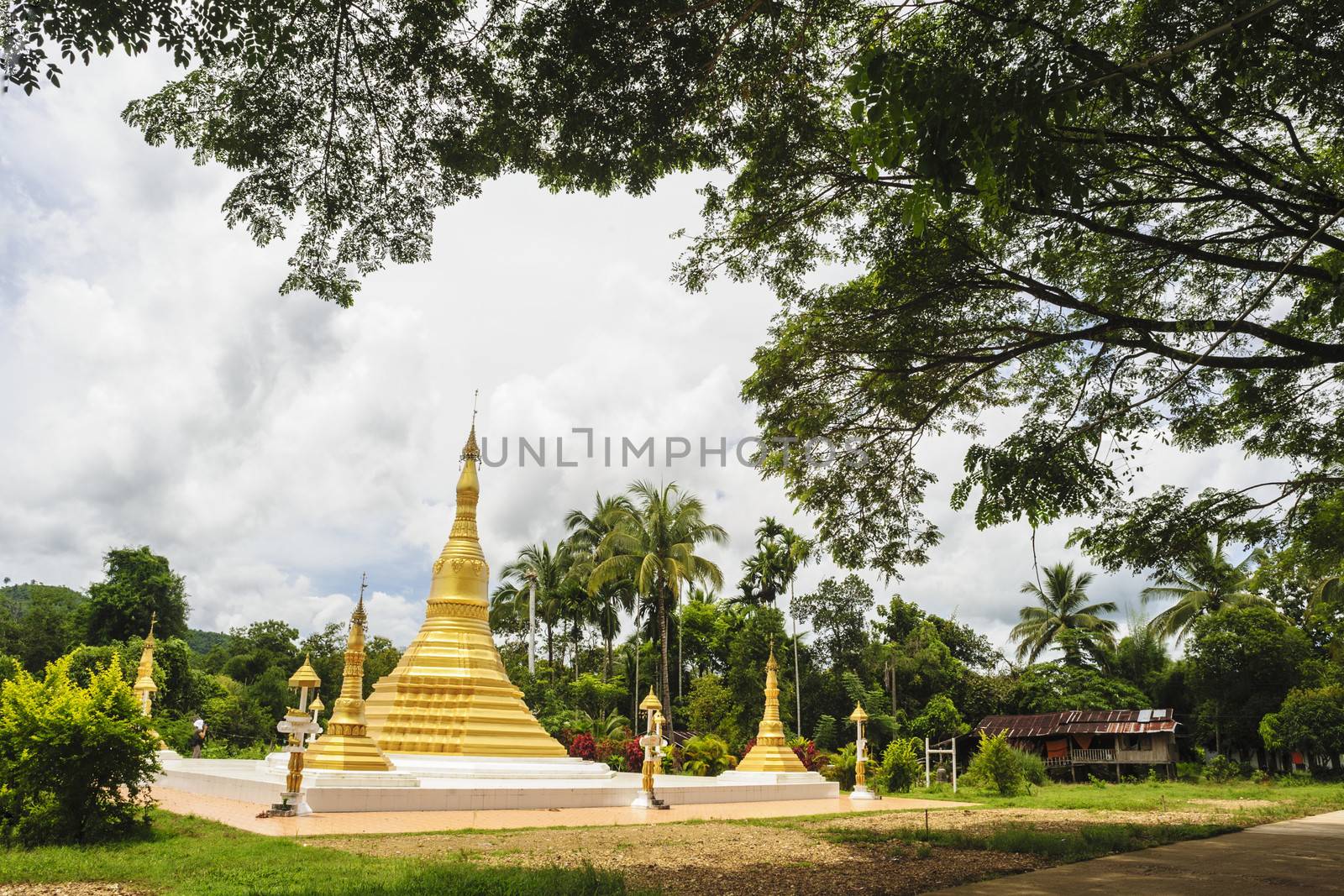 Golden pagoda mixed arts Thailand - Burma in in Thai temple. by ngungfoto