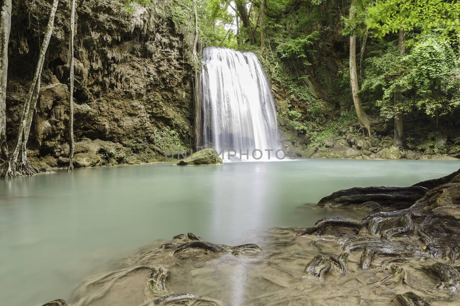 Waterfall in tropical forest at Erawan national park Kanchanabur by panyajampatong