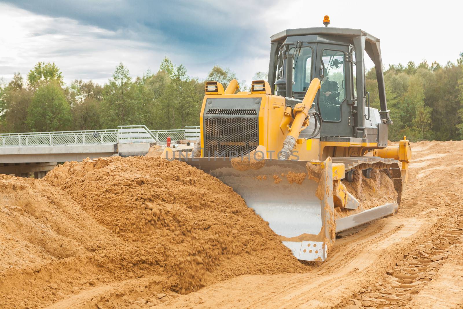 bulldozer moving sand