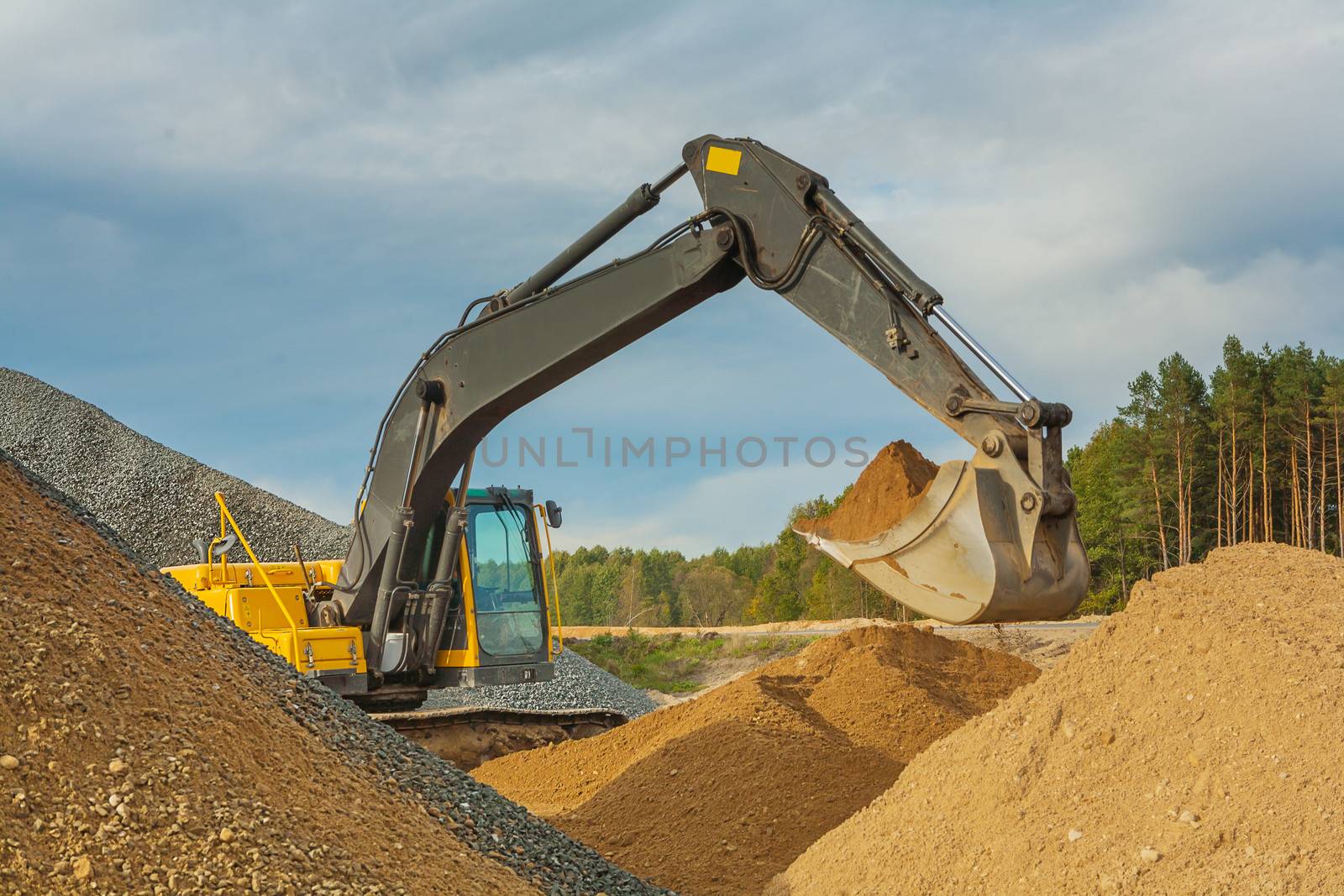 excavator moving sand by mihalec