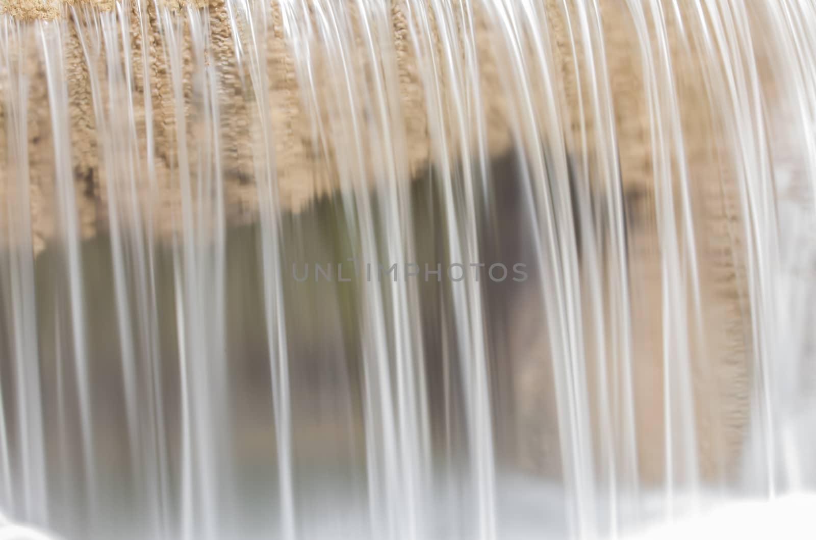 water flowing down from the rocks