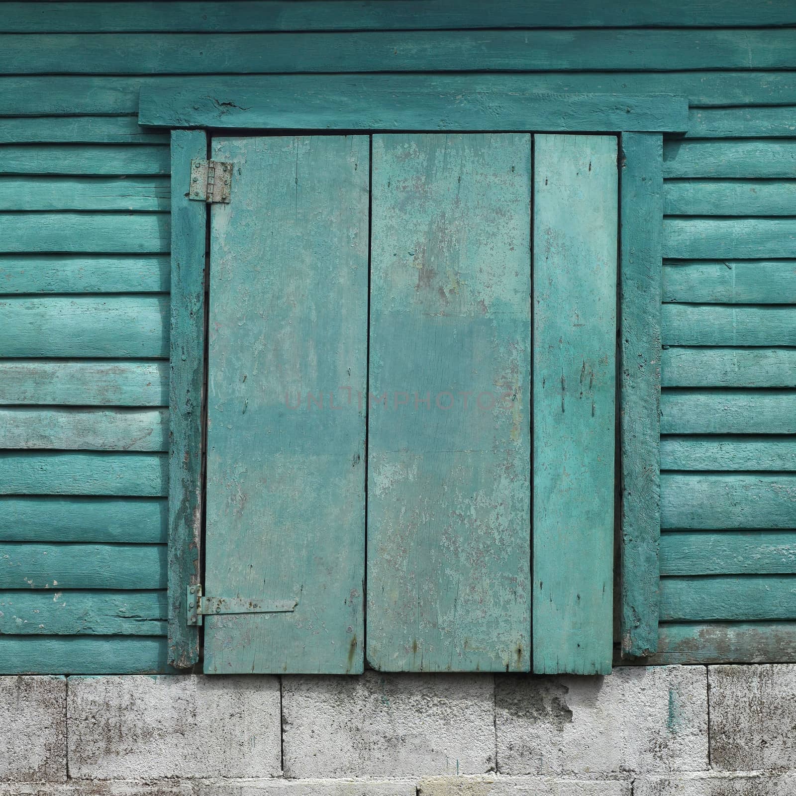 closed window on an old structure
