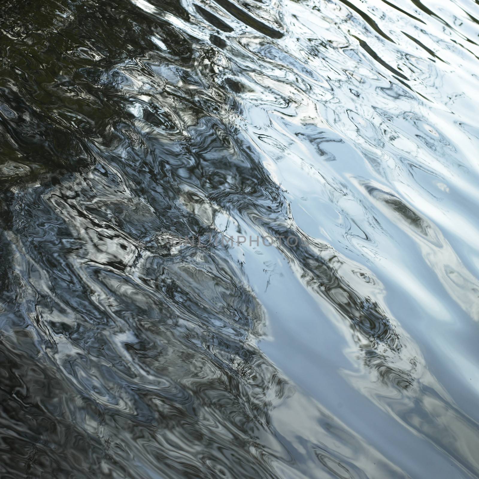 calm lake water with shadow patterns