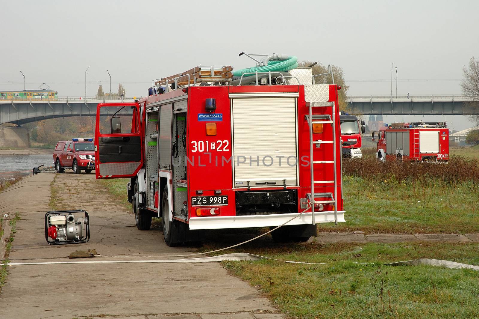 Fire brigade exercises on river bank by janhetman