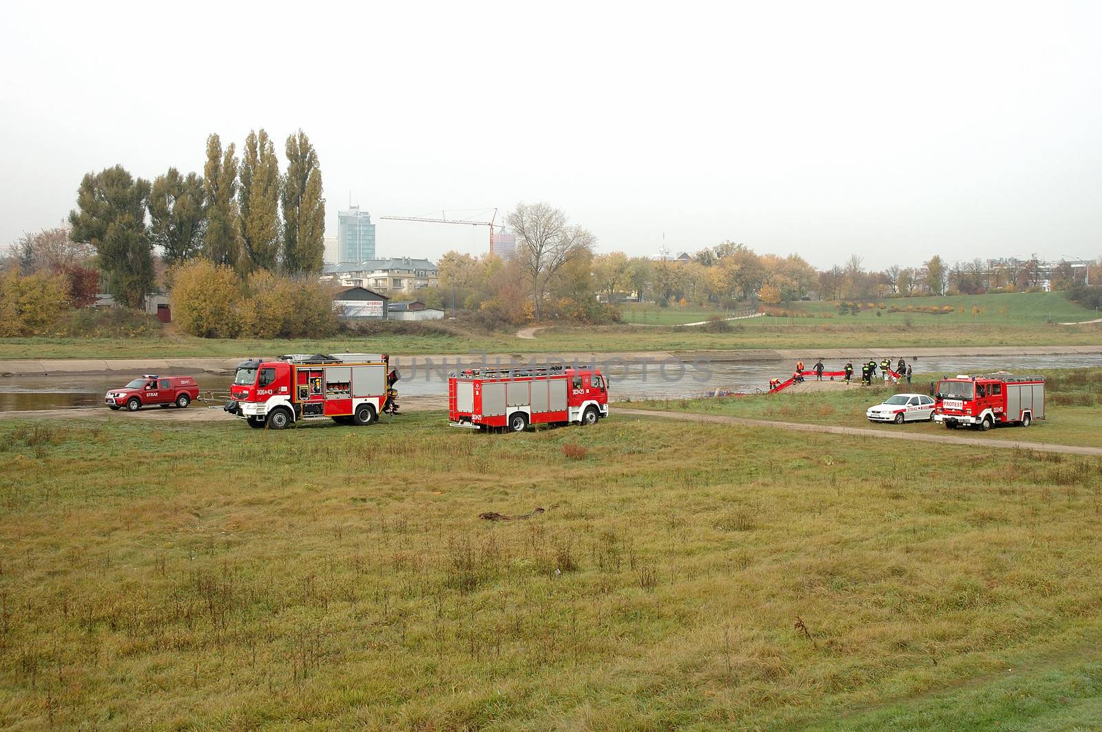 Fire brigade exercises on river bank by janhetman