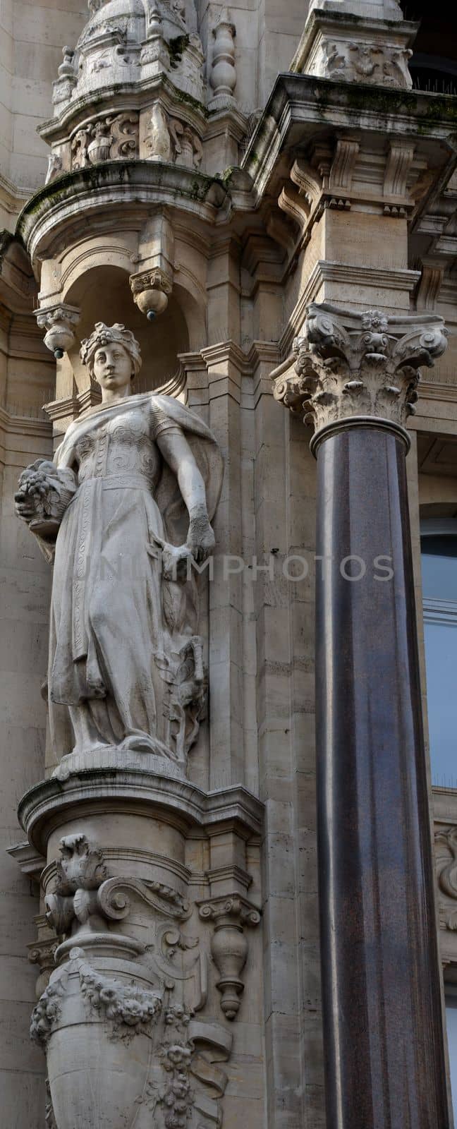 A sculpture at the facade of an old building in Antwerp.