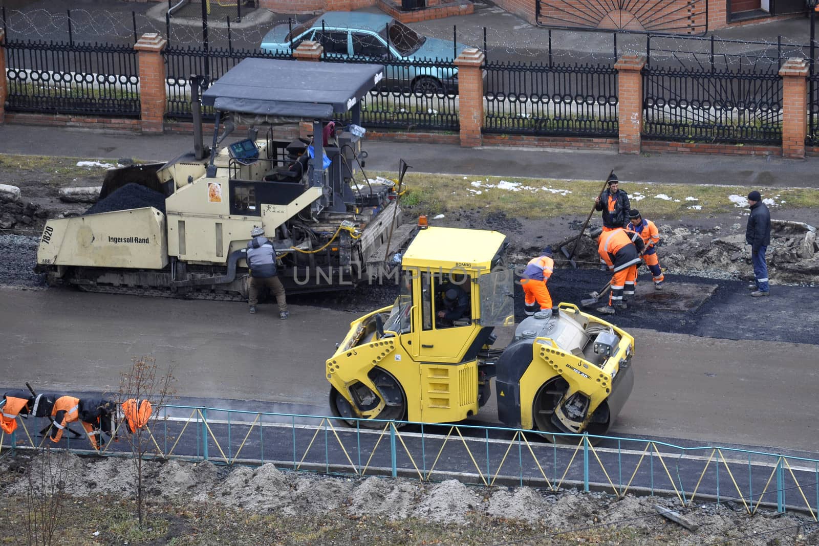 Special equipment on repair of roads. Bulldozer, asphalt spreader.