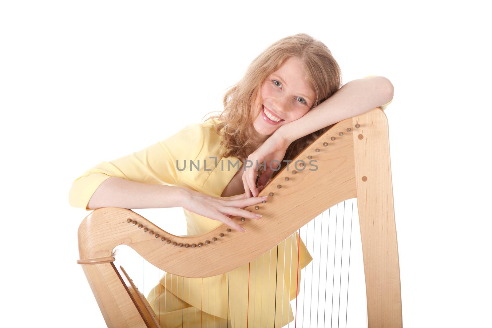 smiling young woman leaning on harp