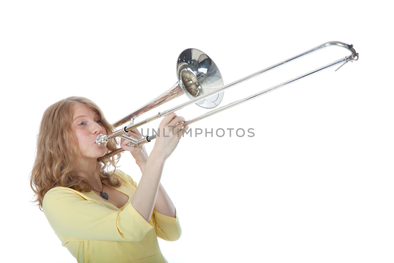 young woman in yellow with trombone by ahavelaar