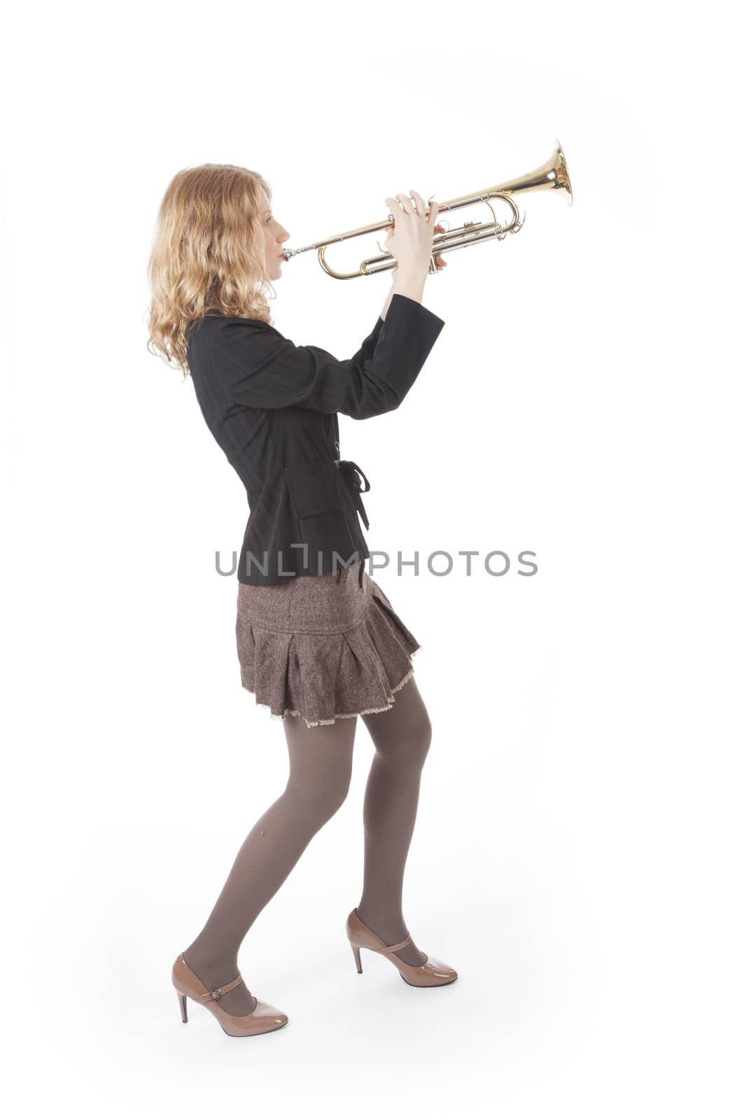 young pretty woman playing the trumpet by ahavelaar