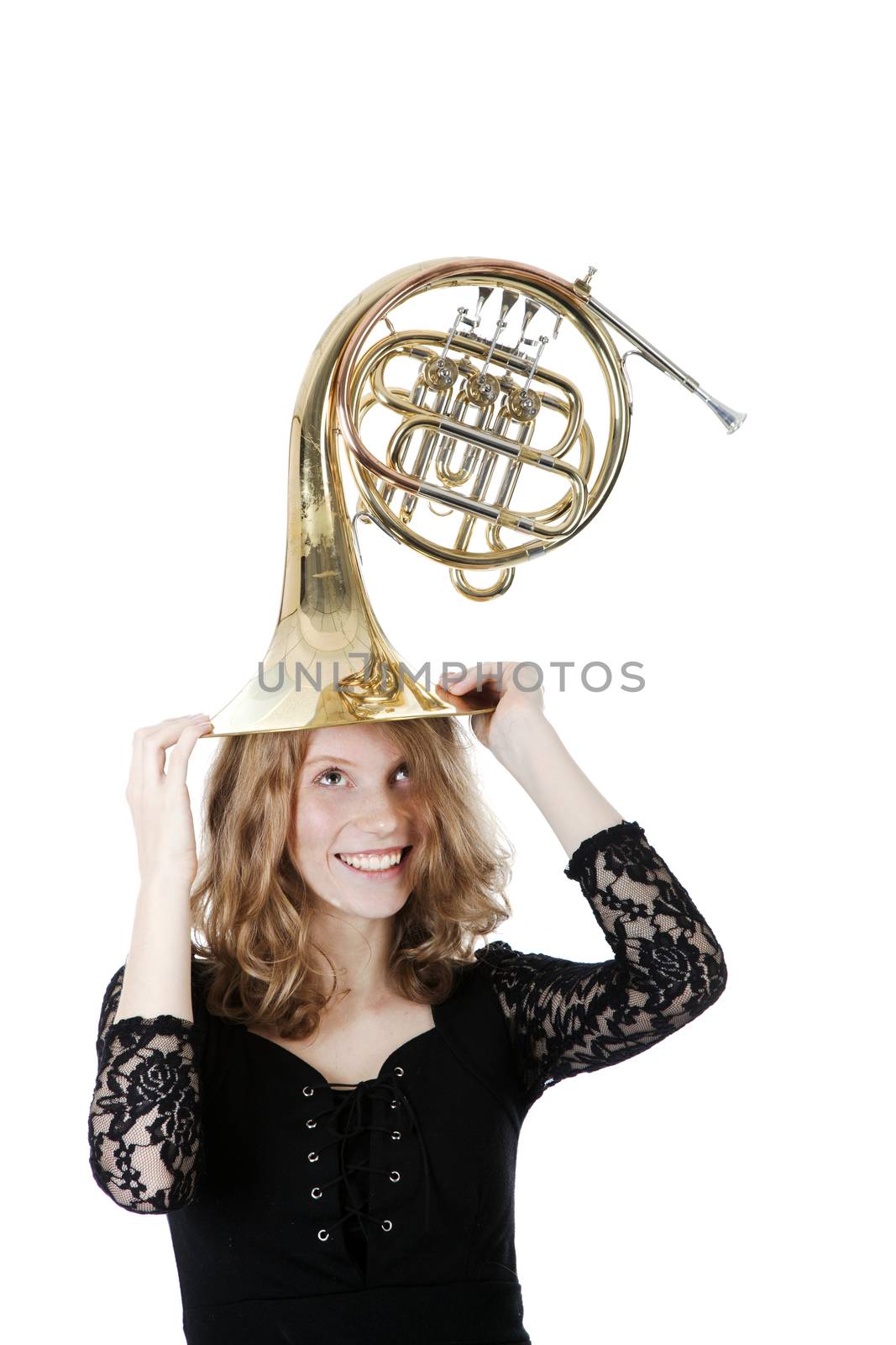 young woman playing with french horn by ahavelaar