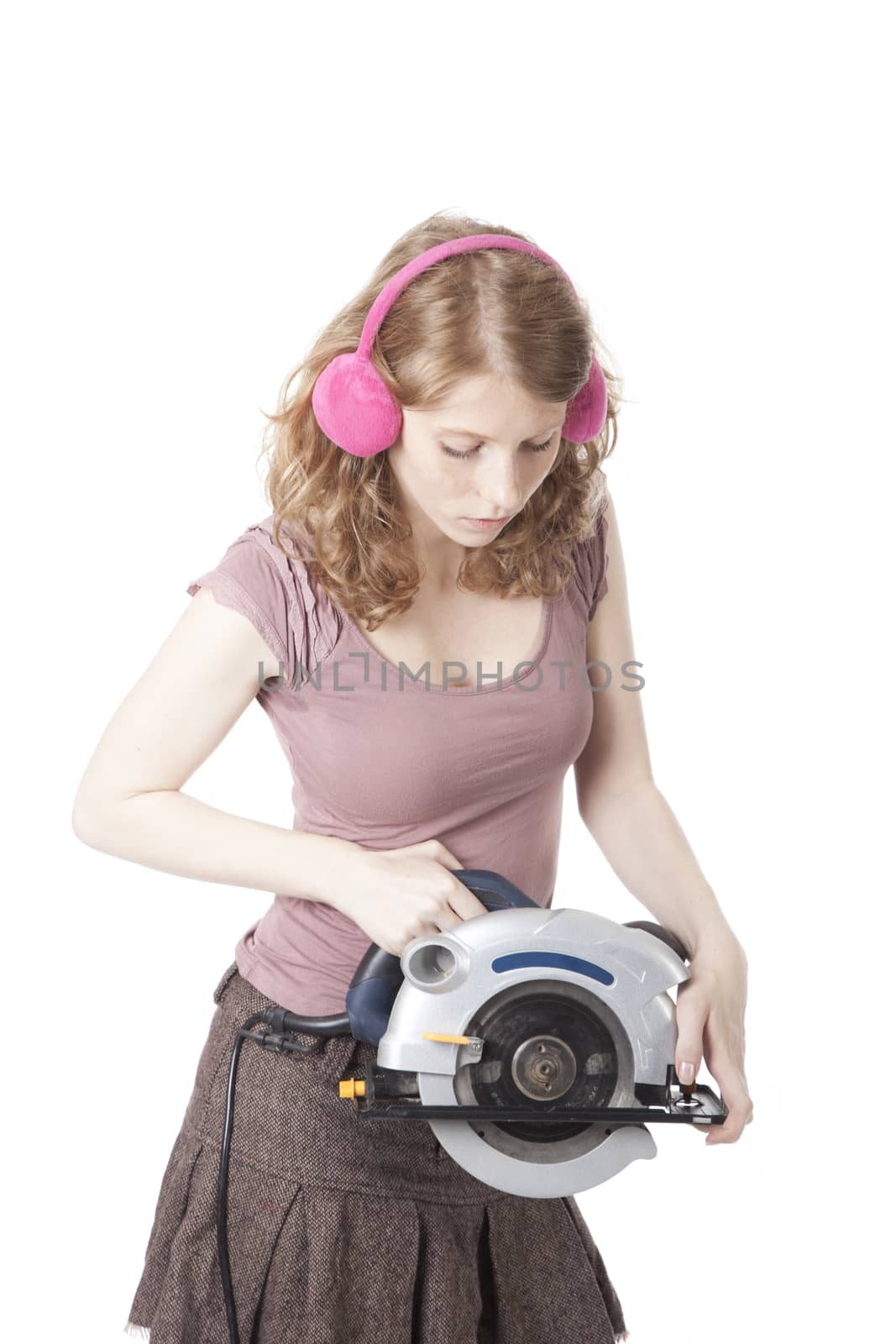 young pretty woman with circular saw by ahavelaar