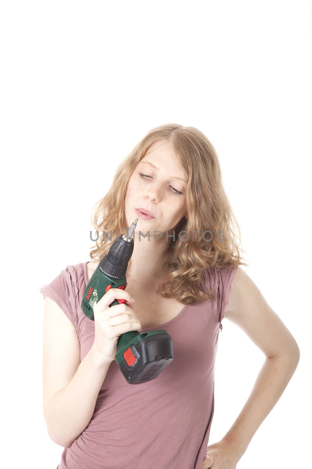 young woman with electric drill by ahavelaar