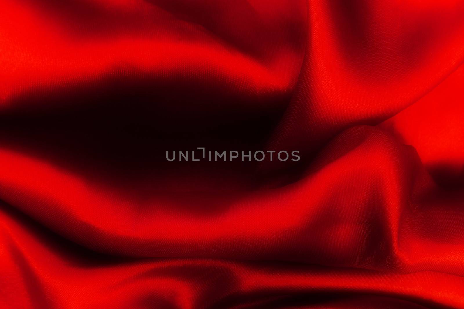 Red folded satin background. Christmas, Valentines day, sunsuality etc concepts