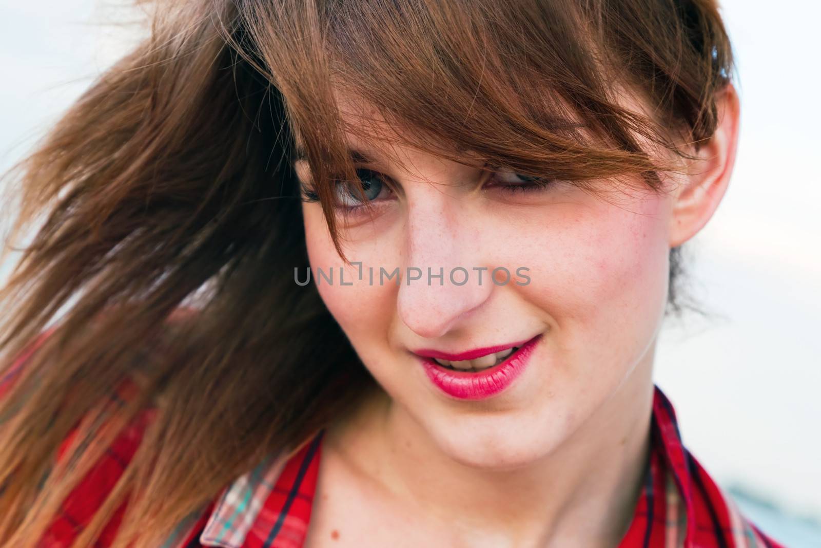 Portrait of fashionable young woman on the beach by photocreo