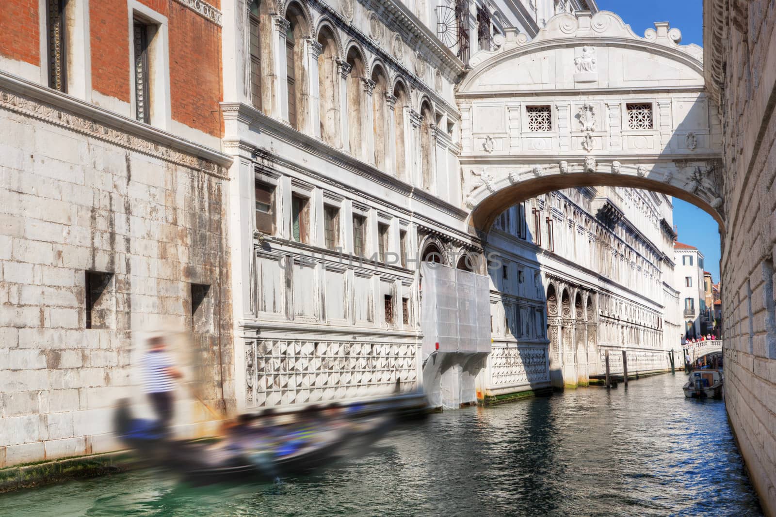 Venice, Italy. The Bridge of Sighs, gondola floats on a canal among old Venetian architecture