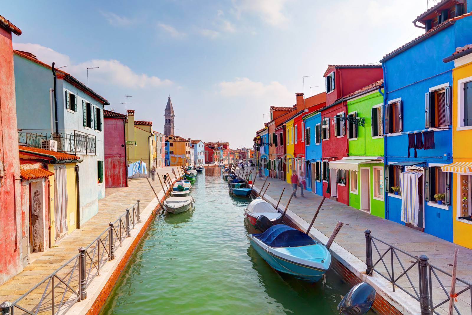 Colorful houses and canal on Burano island, near Venice, Italy. Sunny day.