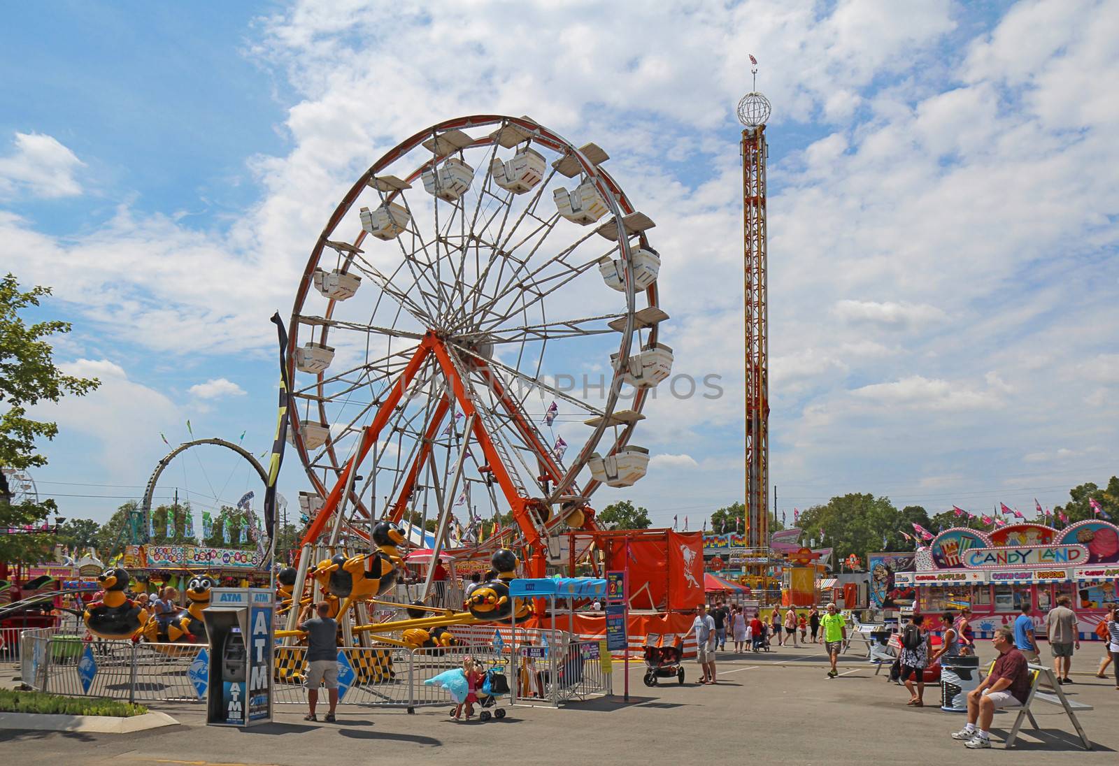 INDIANAPOLIS, INDIANA - AUGUST 12: The ferris wheel and other rides on the Midway at the Indiana State Fair on August 12, 2012. This very popular fair hosts more than 850,000 people every August.