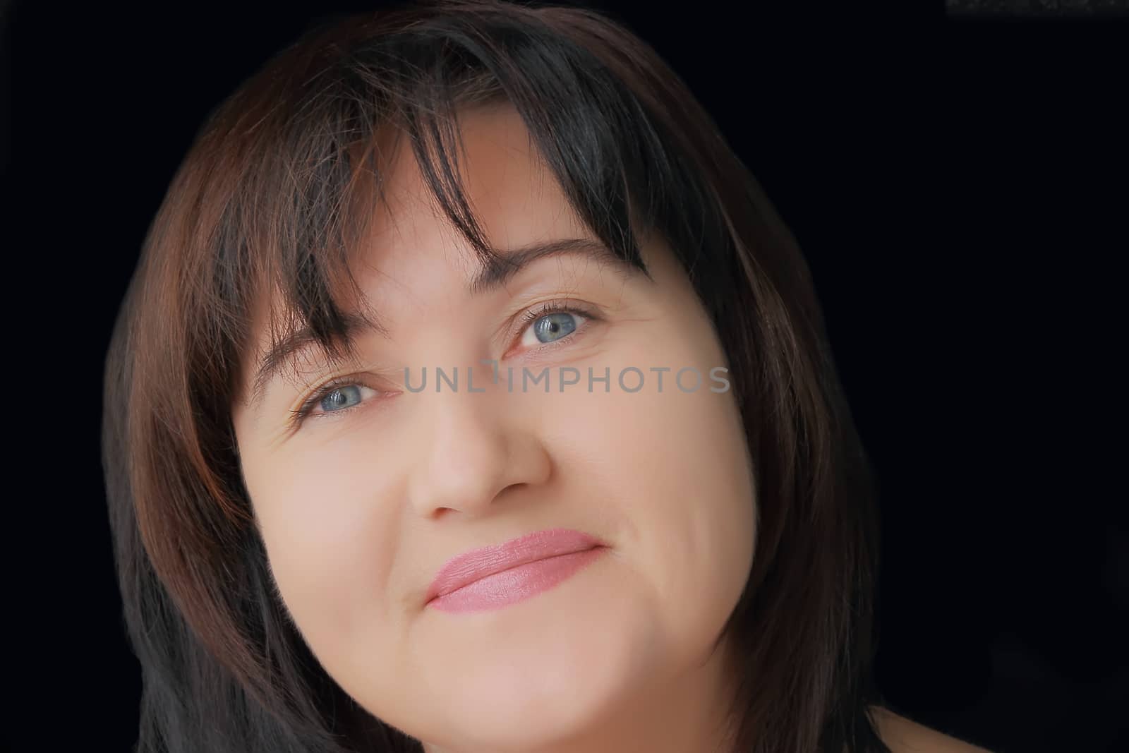 Portrait of woman with blue eyes and black hair