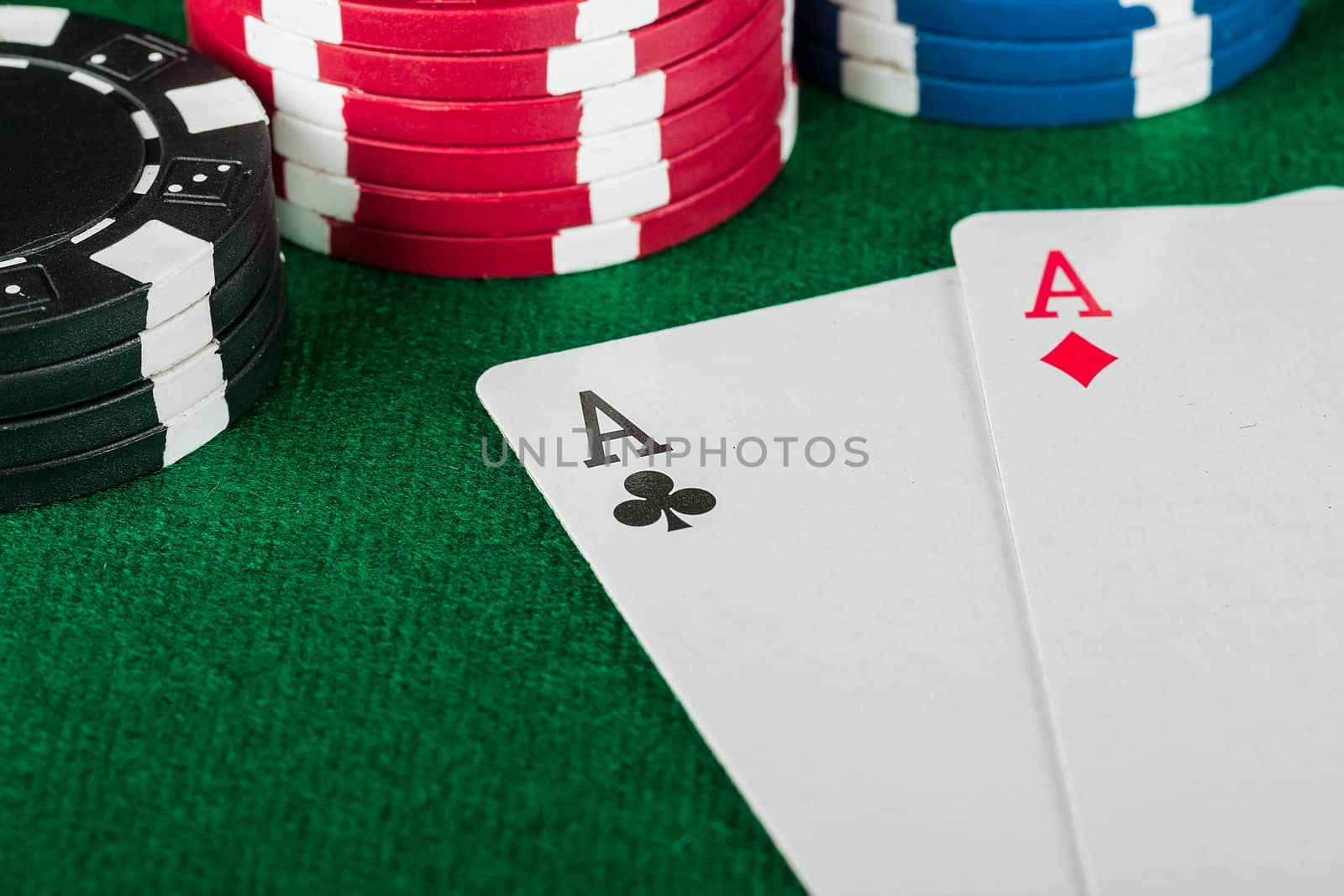 Chip and cards for the poker on the table.