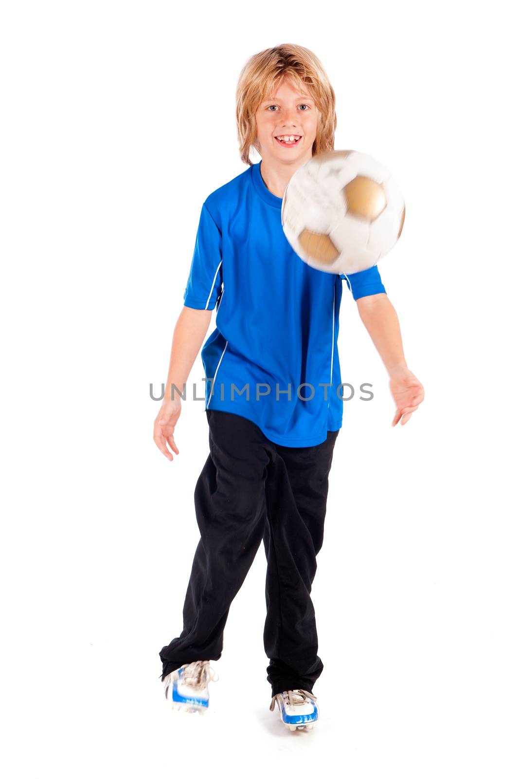 a young boy, playing football on a white background