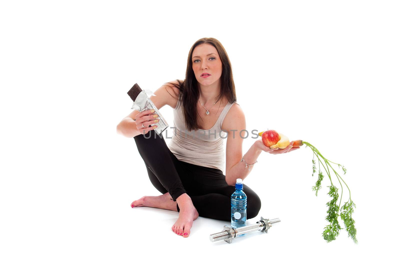 a girl on a diet, with a chocolate and fruit and vegetables