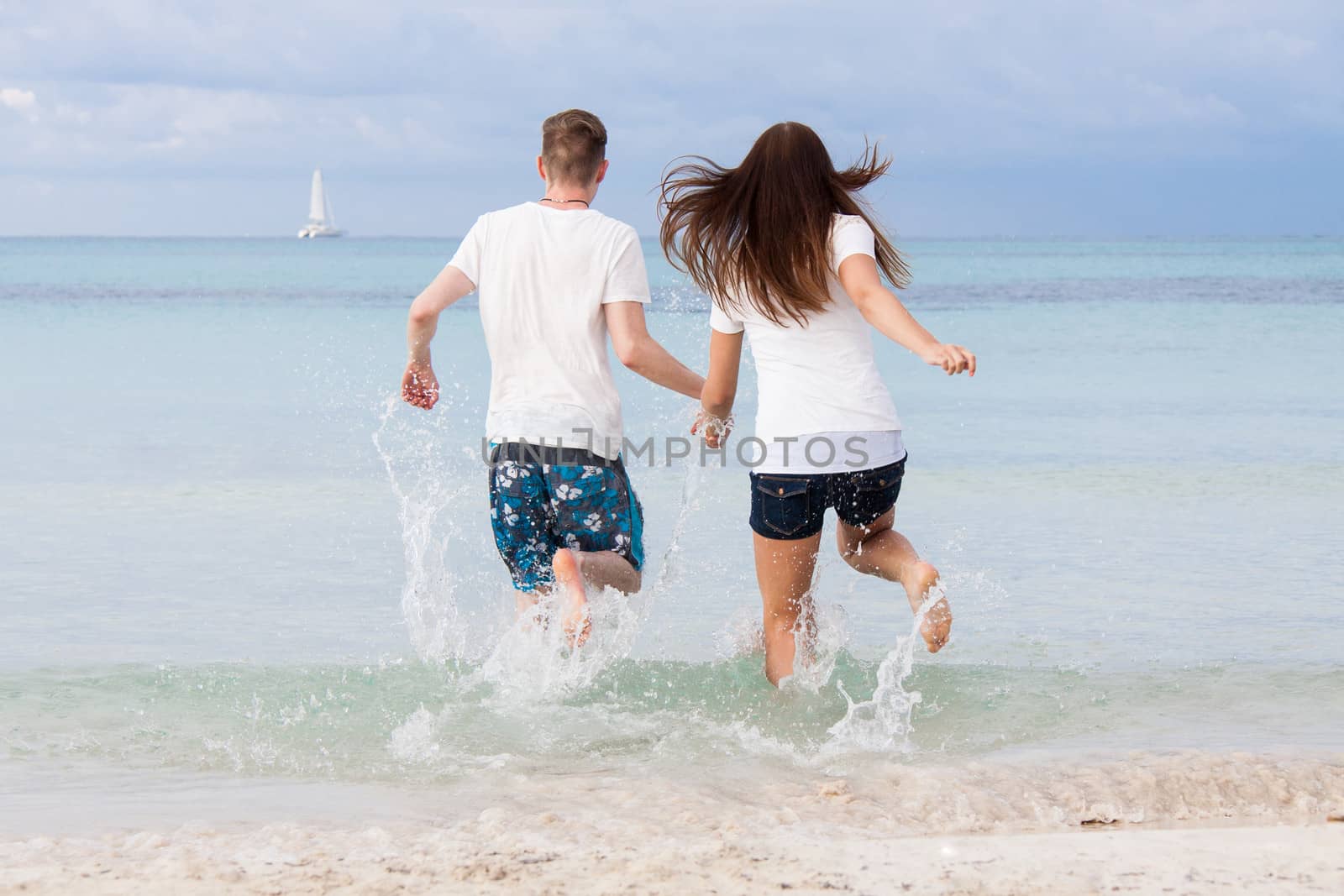 young happy couple in summer holiday vacation summertime by juniart