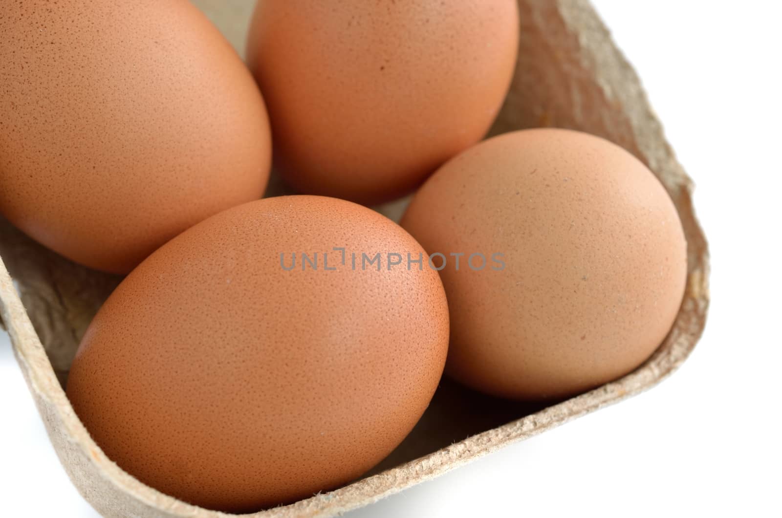 eggs in a paper box isolated on white