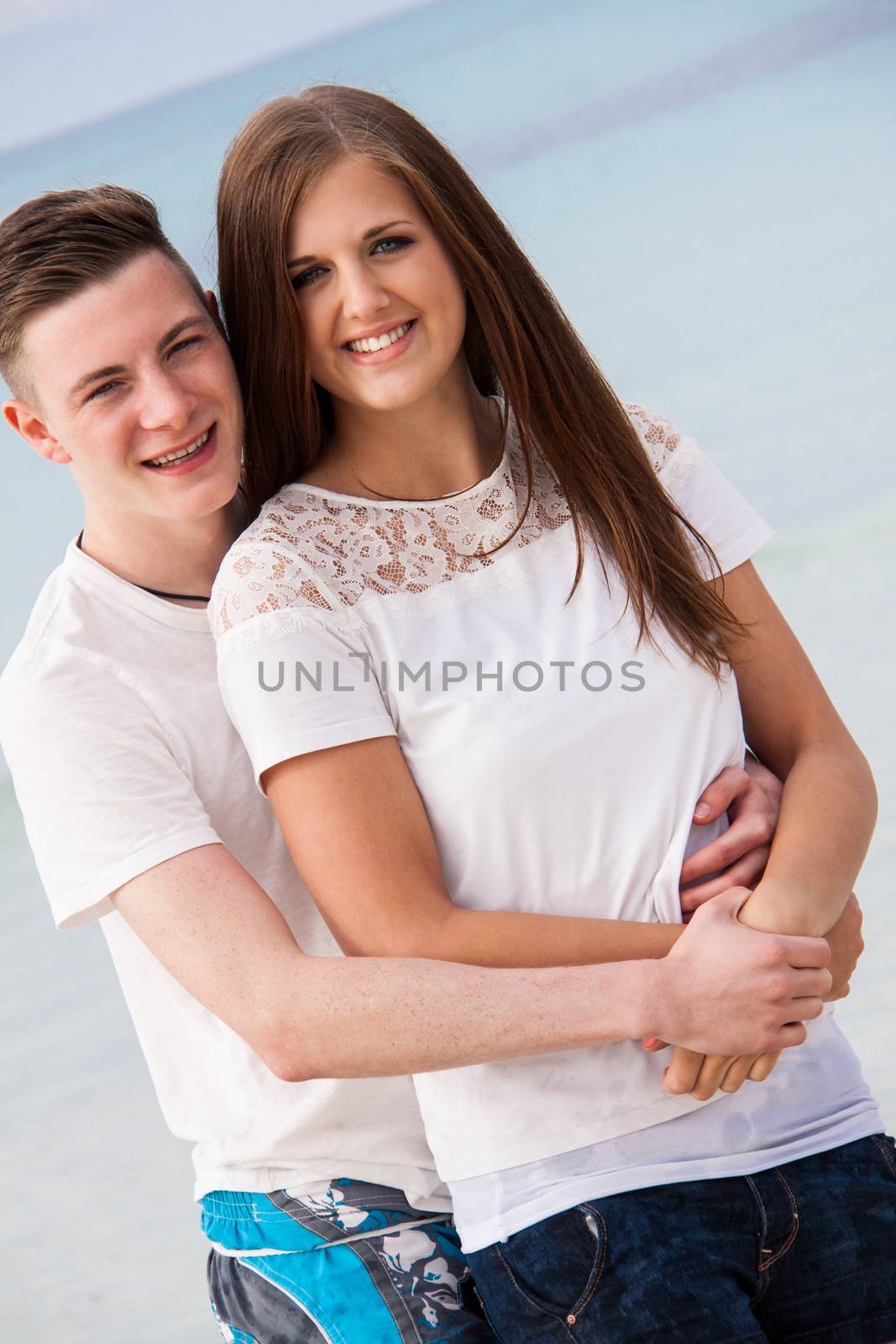 attractive young couple in love having fun in summer holidays by juniart