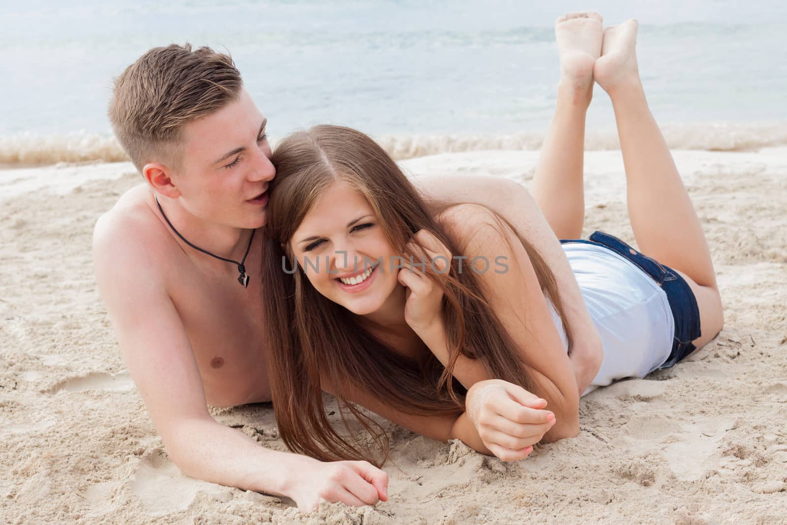 young happy couple in summer holiday vacation summertime beach