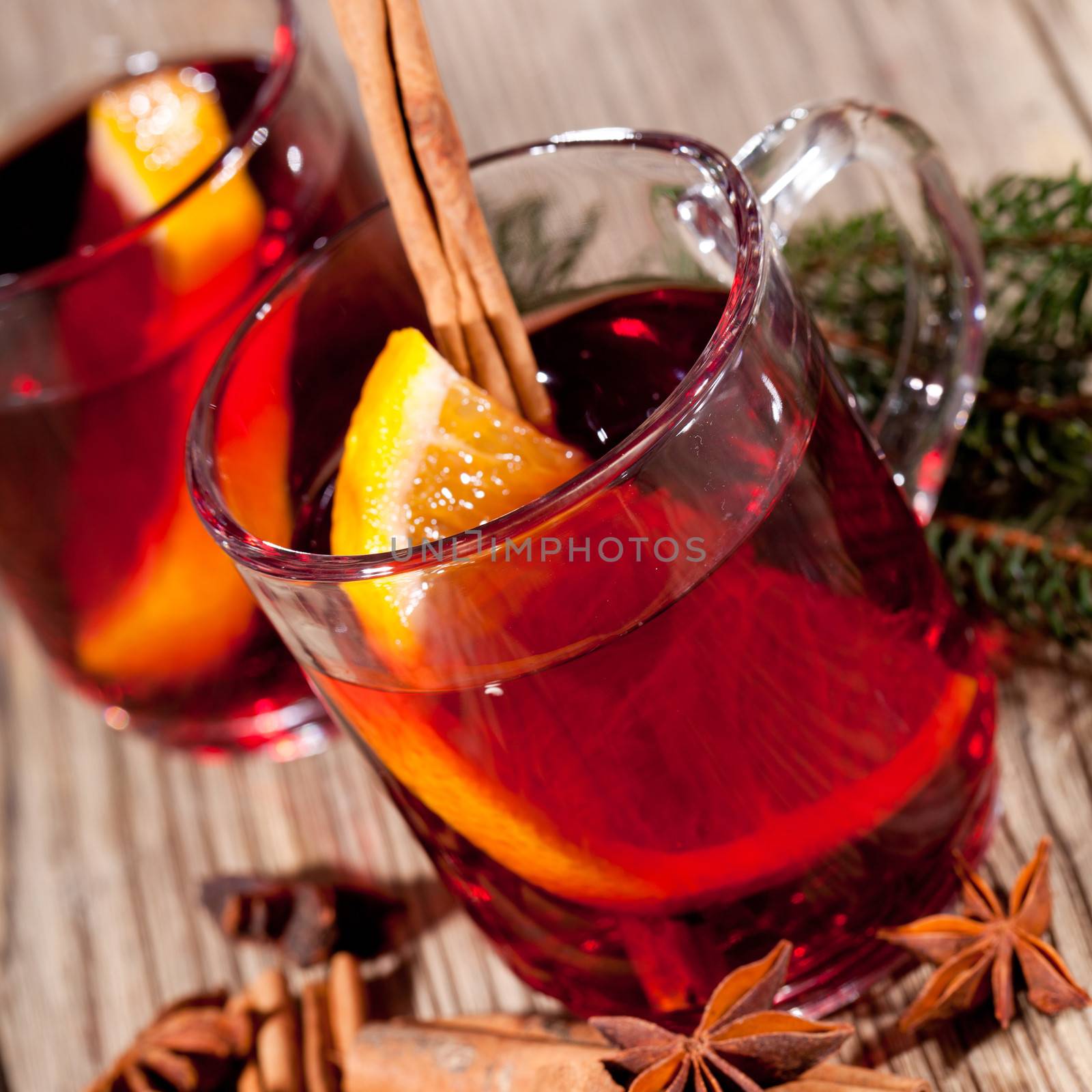 hot tasty spicy mulled red wine with orange and cinnamon christmas  by juniart