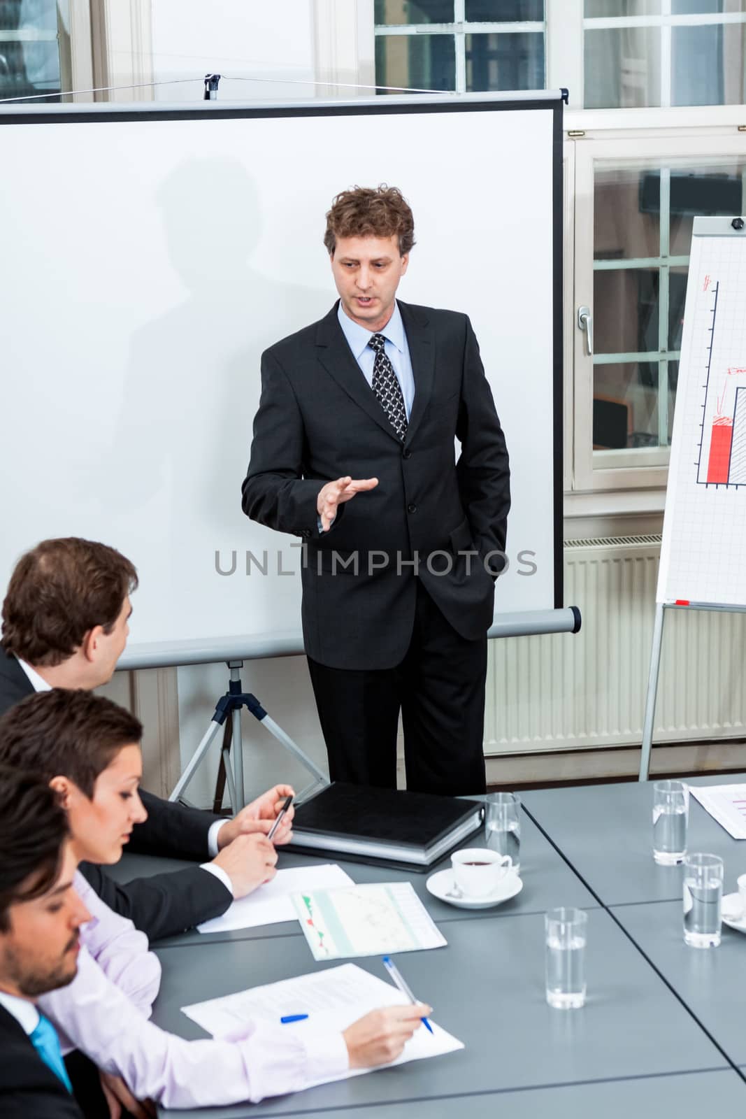 business team on table in office conference seminar presentation