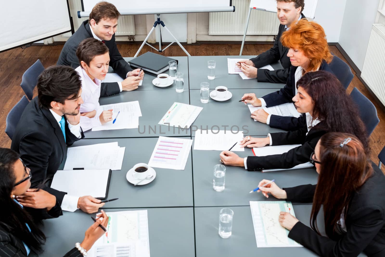 business team on table in office conference by juniart