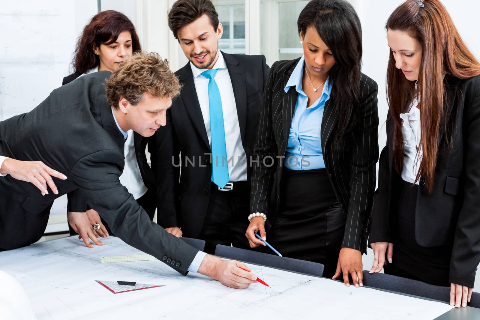 business people discussing architecture plan sketch in office