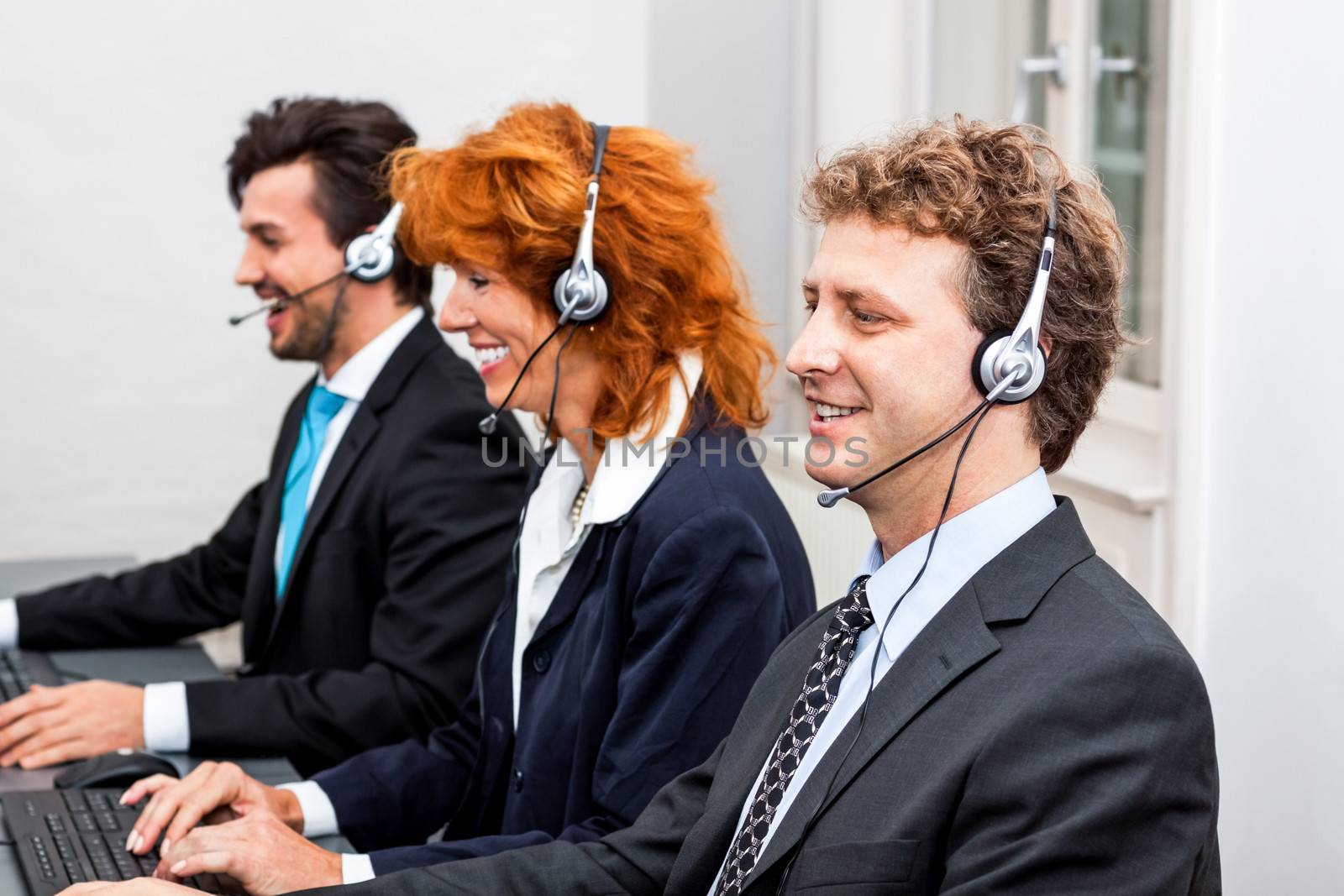 smiling callcenter agent with headset support by juniart