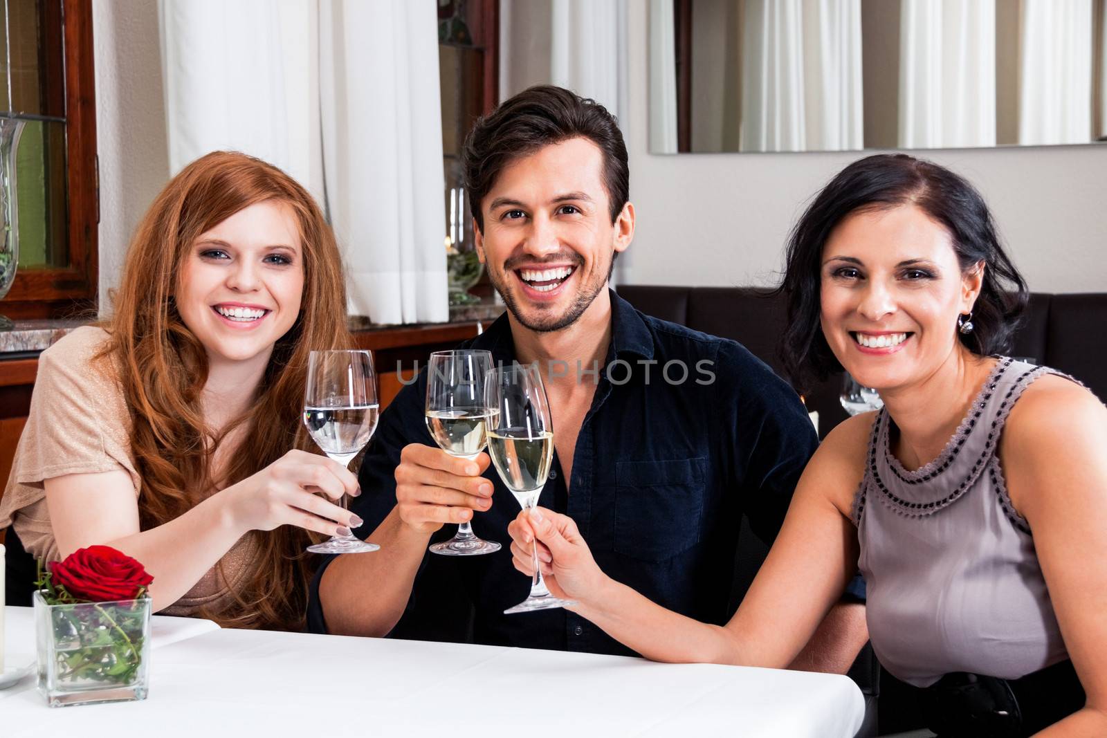 smiling happy people in restaurant by juniart