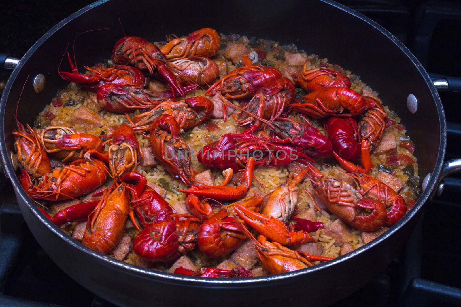 A beautiful skillet full of crawfish jambalaya. This dish was created in the southern United States, in Lousiana.