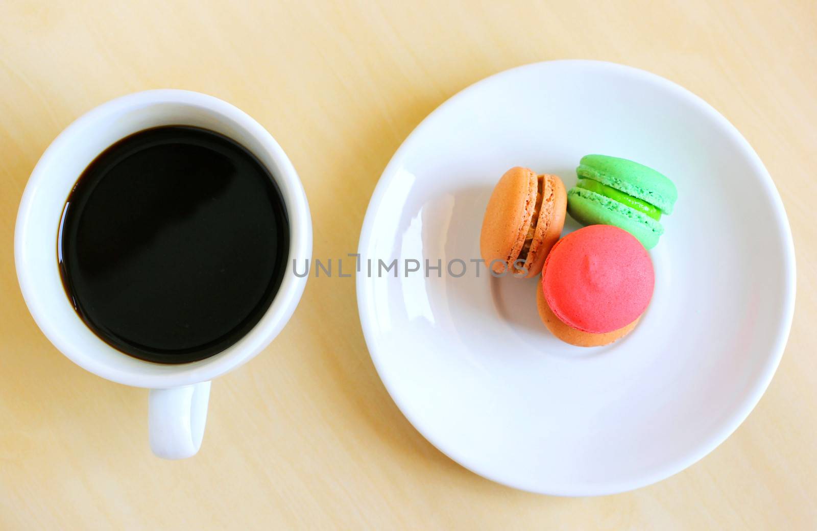 Colorful macaroons and a cup of coffee by nuchylee