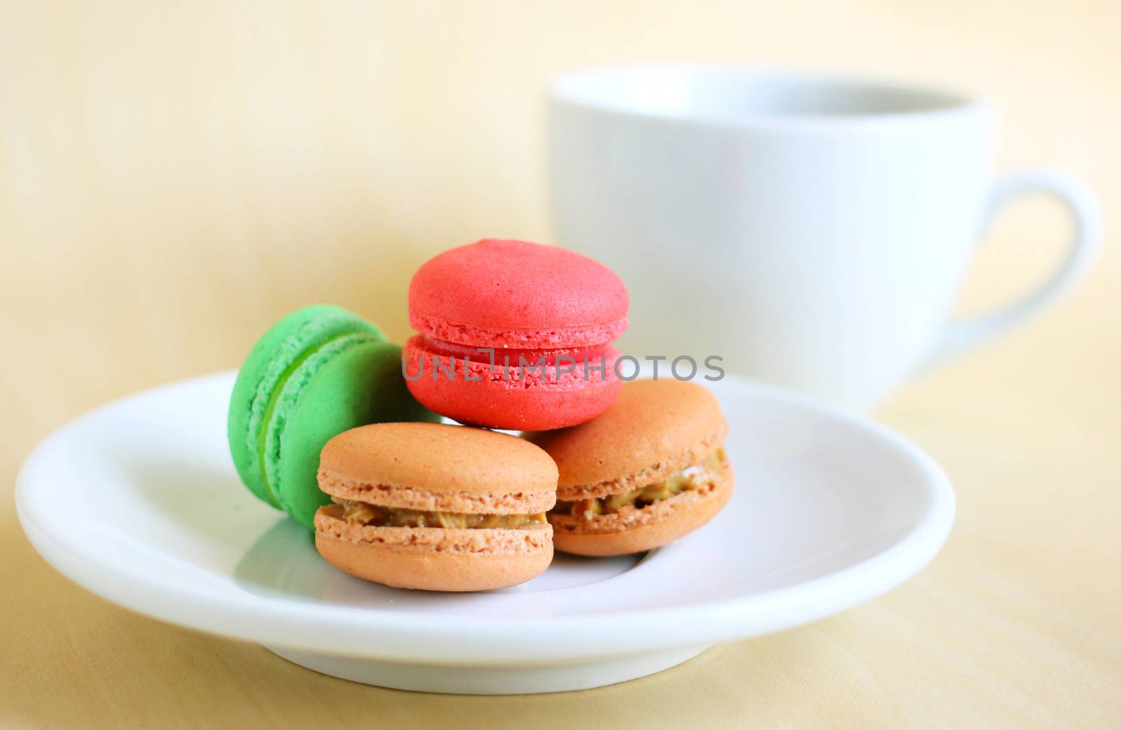 Colorful macaroons and a cup of coffee by nuchylee