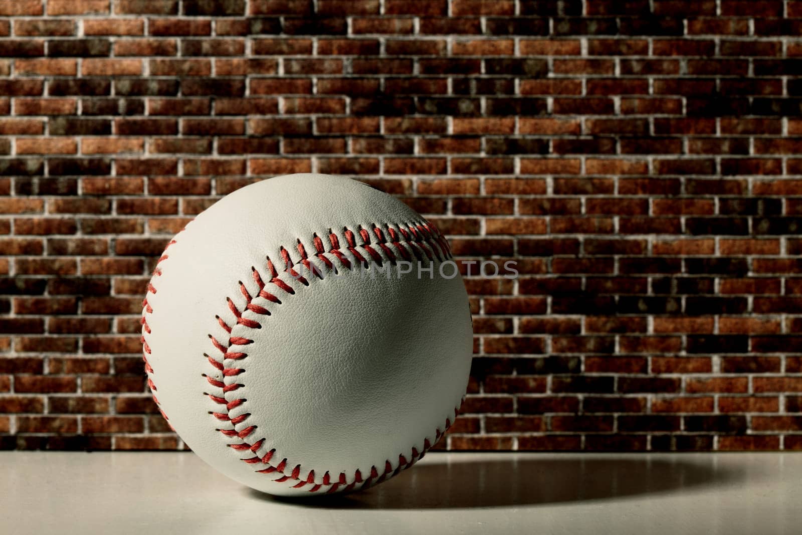 baseball on a brick wall by erllre