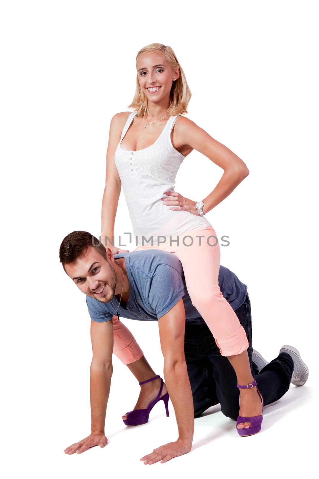 young attractive couple in love embracing portrait on grey backgound 