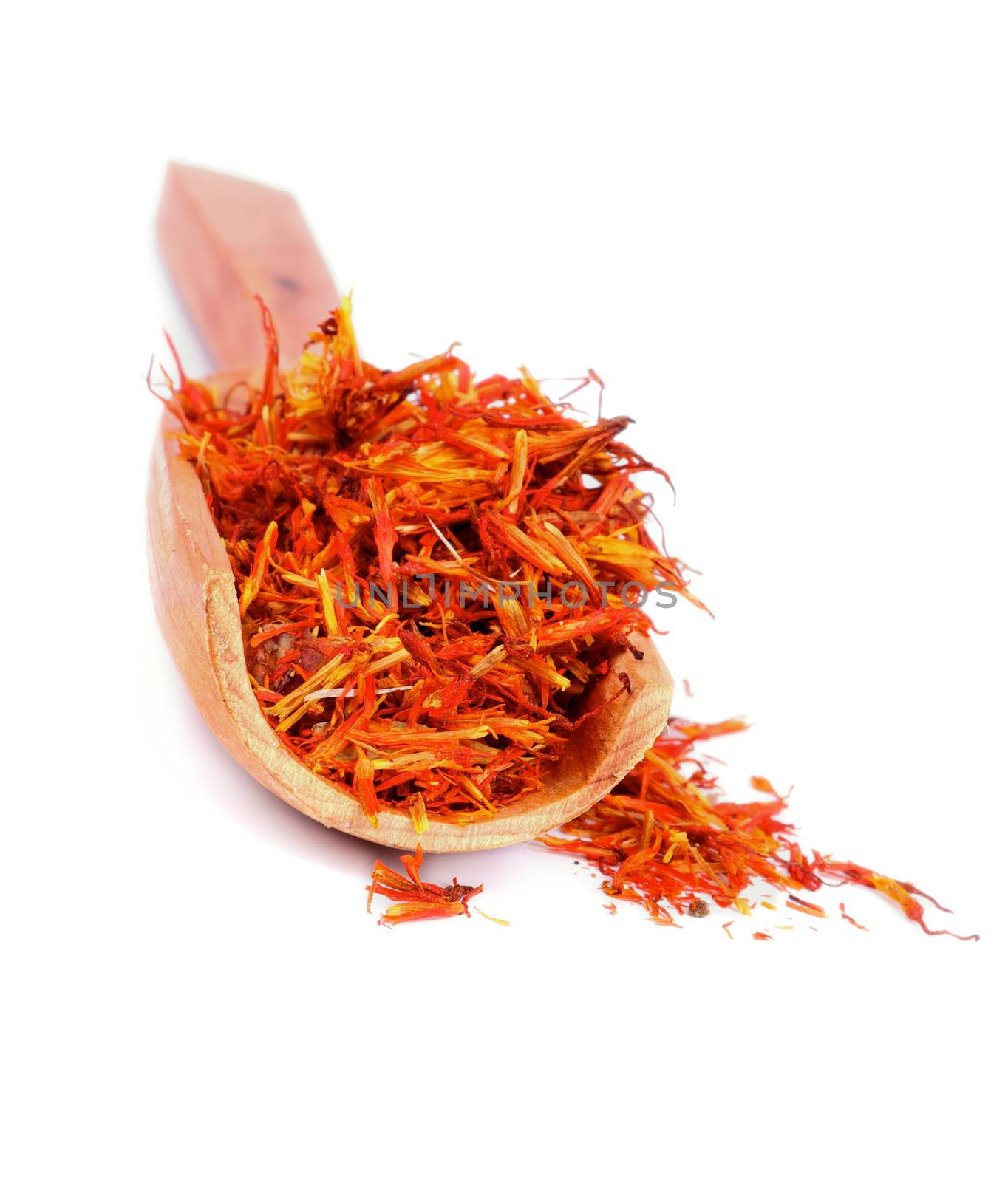 Saffron in Wooden Scoop isolated on white background