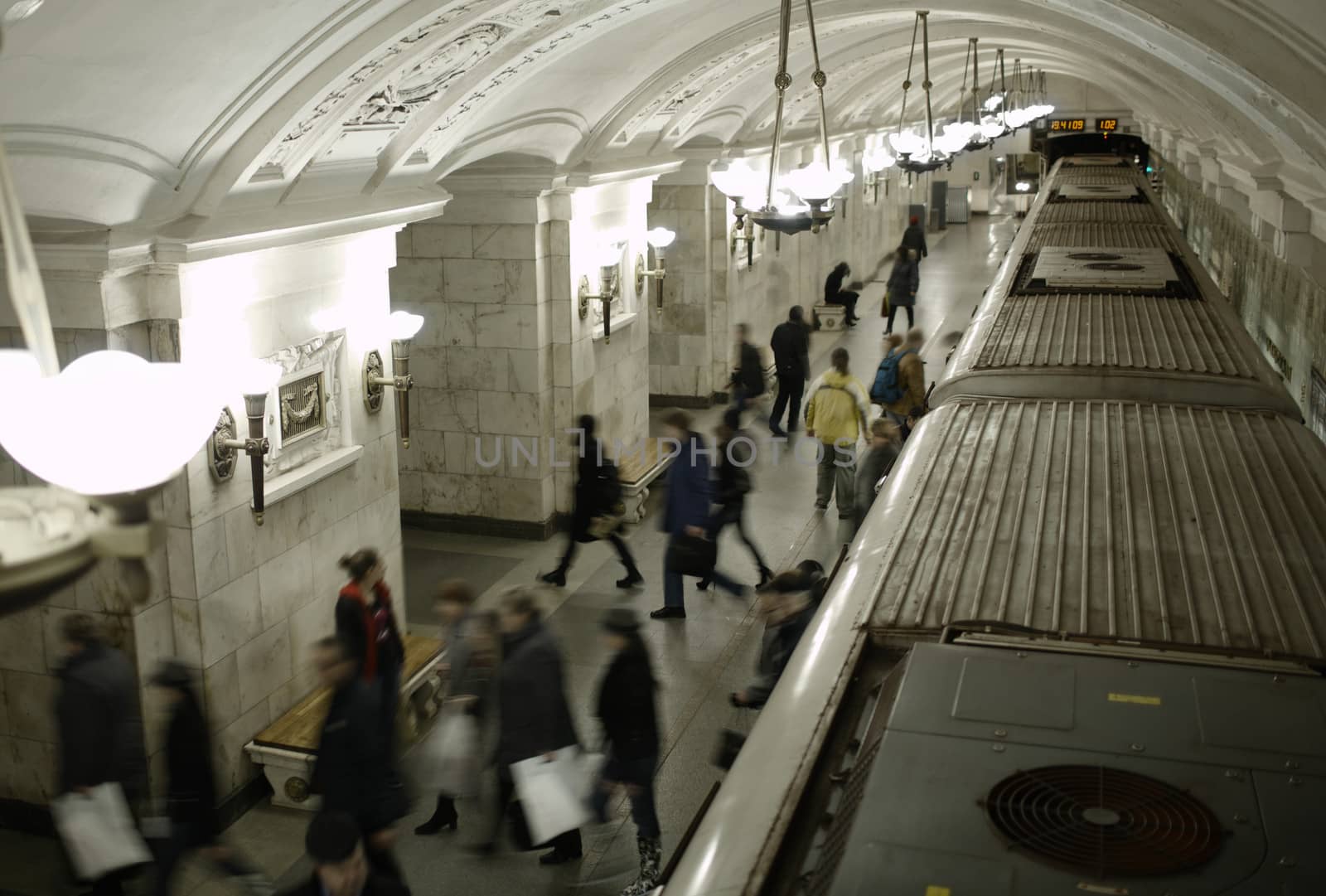 Blurred people on subway platform. by danr13
