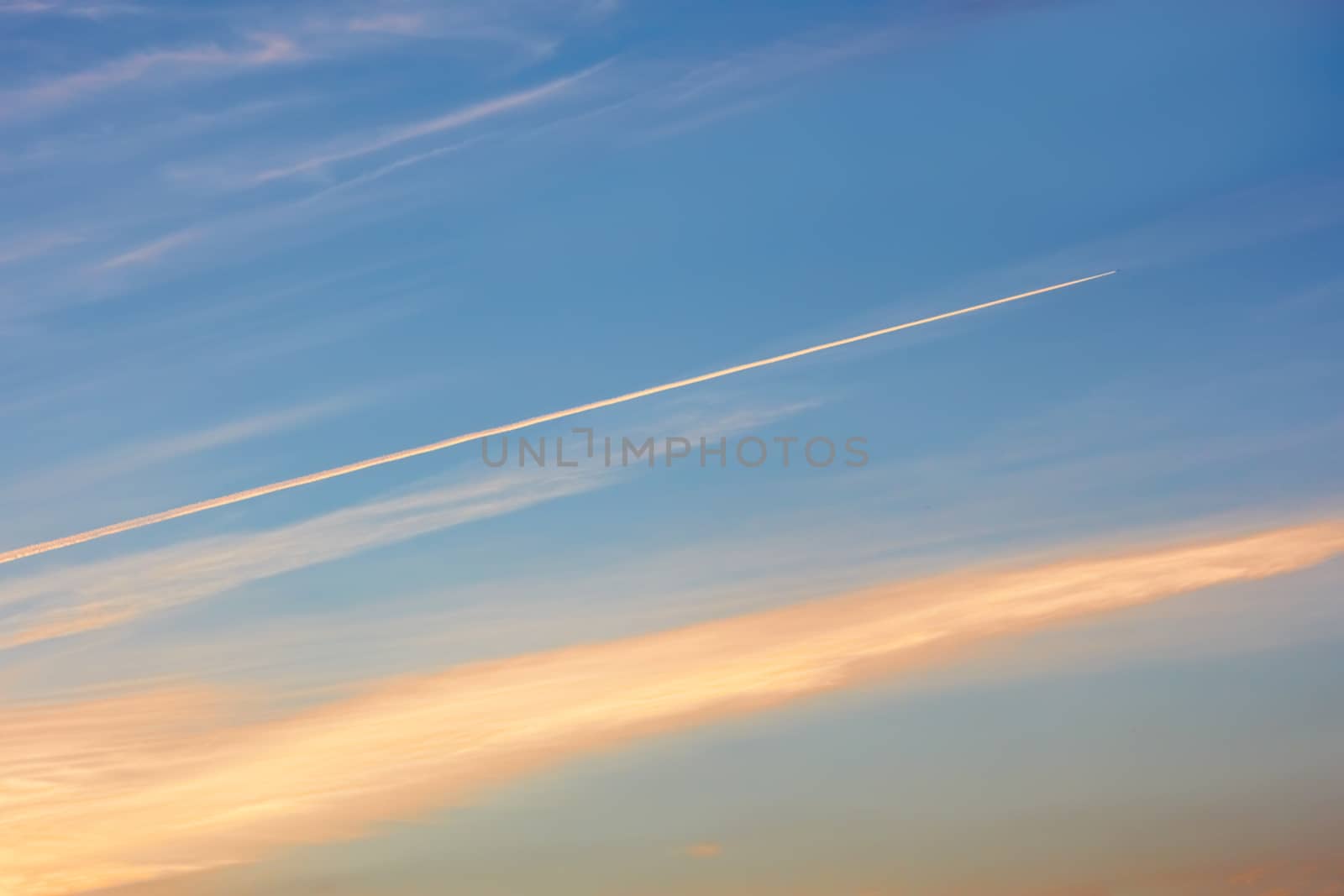 Aircraft track in the evening sky by qiiip