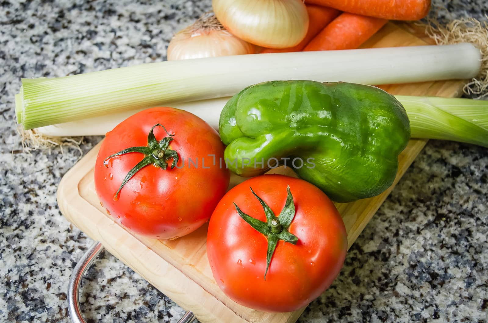 Fresh vegetables on cutting board in the kitchen by doble.d